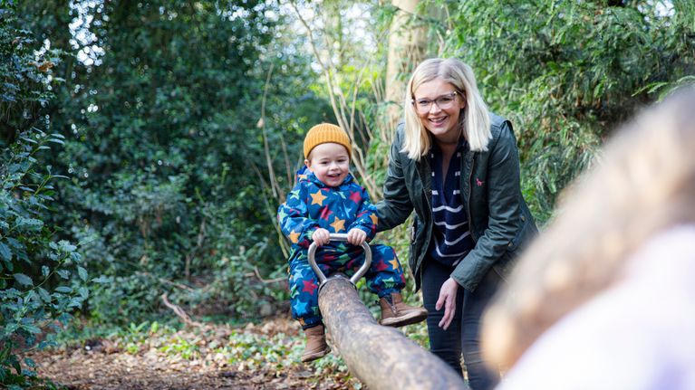 Children playing in the natural woodland play area at Wightwick Manor and Gardens, West Midlands